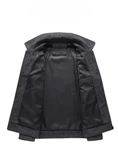 Detail of dark grey wool jacket showing premium inner lining and warm fabric texture