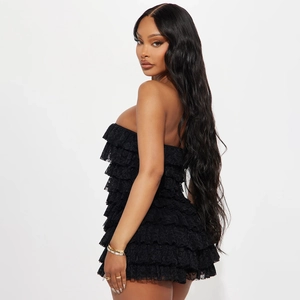 Detail of layered black lace tube romper showing tiered design and premium fabric texture