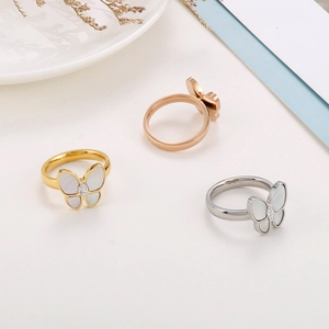 Titanium steel butterfly rings with mother of pearl and diamonds in three metallic colors