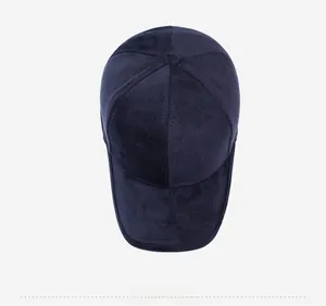 Detail of navy blue winter baseball cap showing textured fabric and mountain sport embroidery
