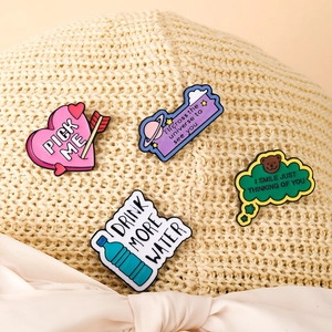 Set of 4 creative alloy enamel pins with colorful lettering on a woven straw hat