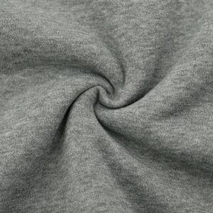 Macro shot of grey knitted cotton jacket fabric showing soft texture and dense weave