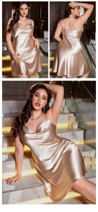 Detail of champagne gold satin slip dress with V-neckline and smooth silk-like texture