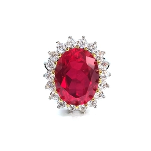 Top view of luxury S925 silver ring featuring a large oval ruby with diamond halo