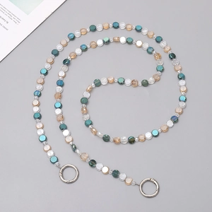 Detail of handmade crystal bead chain for phone or bag with blue and clear beads