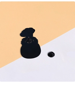 Detail of cartoon cactus enamel pin back with black butterfly clutch and metal needle