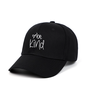 Classic black cotton baseball cap with embroidered be kind lettering and heart symbol