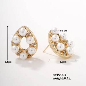 Detailed view of gold pearl rhinestone drop earrings with dimensions 2.1cm by 1.6cm