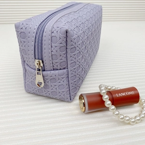 Light purple woven texture toiletry bag with heart zipper and elegant props