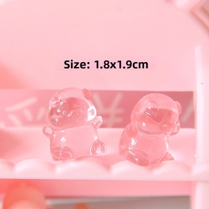 Macro detail of cute translucent pink resin mini pig figurines measuring 1.8x1.9cm