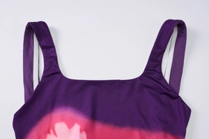 Detail of square neckline and wide straps on purple gradient floral print dress