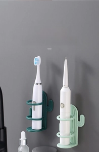Wall-mounted cactus toothbrush holder in green showing hollowed design for water drainage