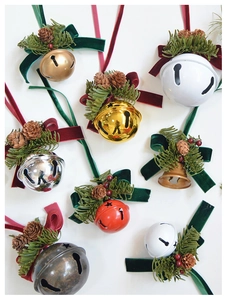 Close-up of velvet bows, pine cones and metal bells for Christmas tree decoration