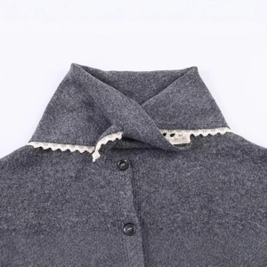 Dark gray knitted cardigan featuring a sailor collar with white lace trim and black buttons