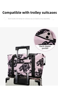 Pink travel bag with elephant print featuring a trolley sleeve and back zipper pocket