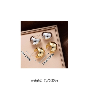 Detailed view of chunky C-shape hoop earrings in gold and silver showing 3cm size
