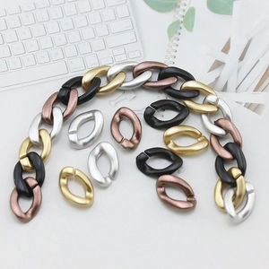 Close-up of DIY acrylic chain link connectors in gold, silver, bronze and black finishes