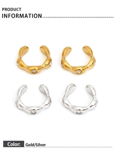 Detail view of gold and silver irregular ear cuffs with shimmering zircon stones