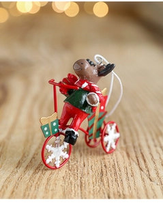 Festive reindeer riding bicycle ornament with warm bokeh lights and rustic wood base