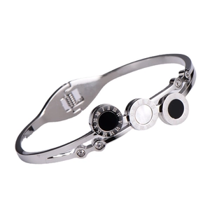 Silver open bangle with Roman numerals, black and white shell rings and crystals