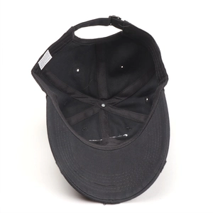 Inside view of black cotton distressed baseball cap showing seams and adjustable strap