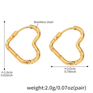 Detailed size view of gold stainless steel heart hoop earrings with hammered texture