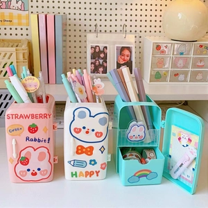 Three mini fridge pen holders in pink, white, and blue colors for desk organization