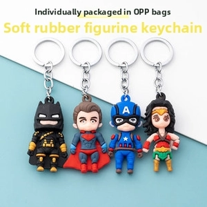 Set of four superhero PVC keychains including Batman and Superman with metal rings