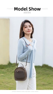 Vintage brown monogram crossbody bag with leather pocket and gold hardware detail