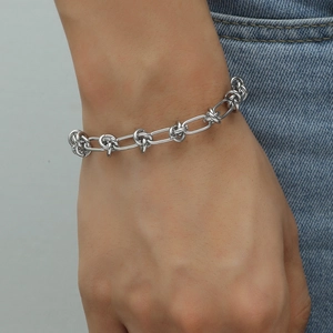 Men's silver link chain bracelet with unique knot design in minimalist hip hop style