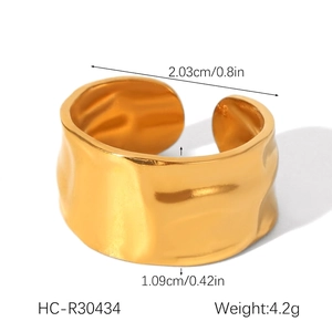 Detailed view of the gold irregular wave ring showing dimensions 2.03cm diameter and 4.2g weight