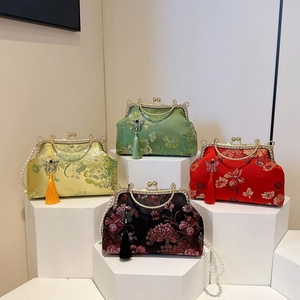 Embroidered shell bags in four colors with pearl handles and elegant silk tassels