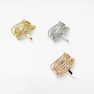Detail of metal wire-wrap hair cuff hooks in gold, silver, and rose gold colors