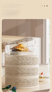 Three-tier stackable food cover with hollow woven texture and golden handle detail