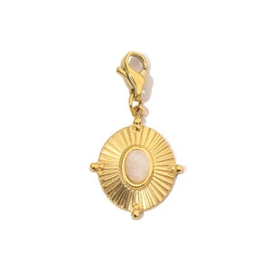 Detail of gold sunburst charm with natural white stone inlay and lobster clasp