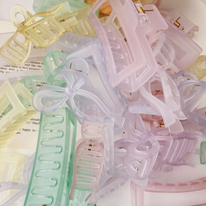 Colorful matte acrylic shark hair clips in various rectangular and bow shapes for women