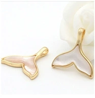 Detail of 14k gold-plated whale tail pendant with mother-of-pearl inlay for DIY jewelry