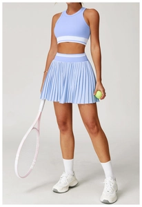 Detail of light blue tennis set featuring a racerback tank top with white stripe accents
