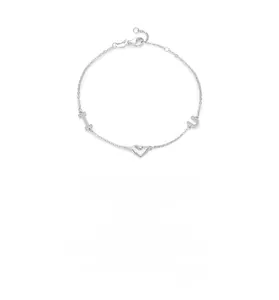 Macro detail of S925 sterling silver bracelet with pavé cross, heart, and horseshoe charms