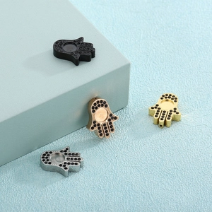 Hamsa Hand charms in gold, silver, black, and rose gold with micro-pave crystals