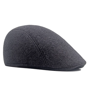 Detailed close-up of dark grey newsboy cap showing winter thickened wool blend texture