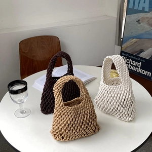 Three handmade cotton rope woven tote bags in brown, beige, and white colors