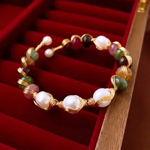 Handcrafted open bangle with natural pearls and colorful gemstones in gold wire wrap
