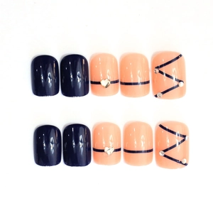 Detailed view of short square press-on nails with blue and peach design and rhinestones