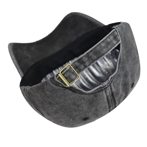 Detailed back view of washed cotton baseball cap with adjustable metal buckle closure
