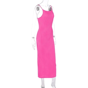 Detailed texture of wave-ribbed hot pink bodycon dress fabric with thin shoulder straps