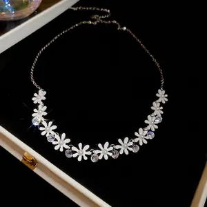 Elegant daisy flower necklace with white faux pearls and zircon in a black jewelry box