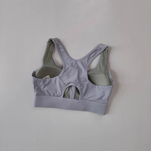 Lilac racerback sports bra with breathable mesh lining and hollow-out back detail