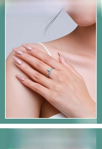 Detail of S925 sterling silver ring with oval turquoise stone and pavé setting
