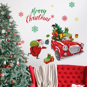 Detail of Merry Christmas wall stickers with Santa, red car and snowflakes on white wall